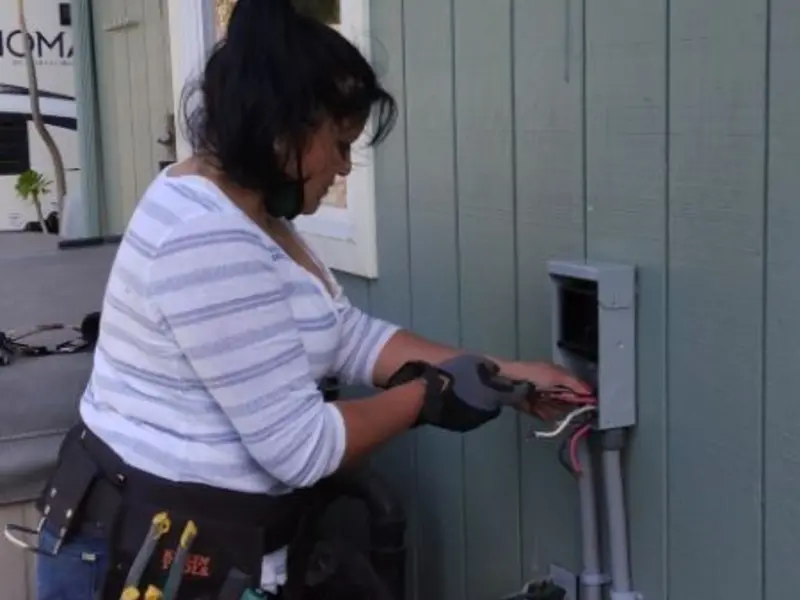 Licensed electrician wiring an exterior subpanel in Port LaBelle
